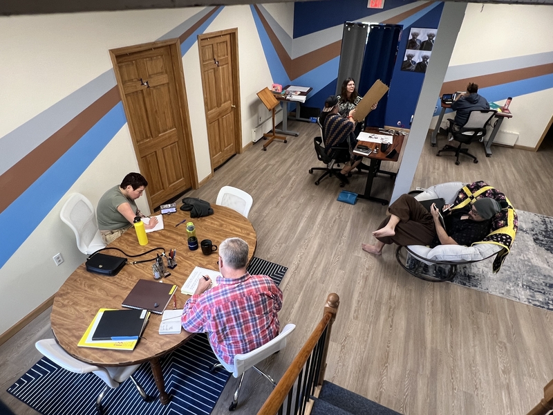 Guests working on Inktober illustrations together